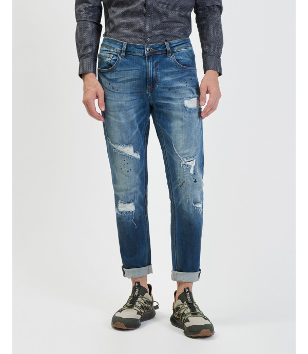 Kevin skinny fit medium wash jeans with rips and paint droplets