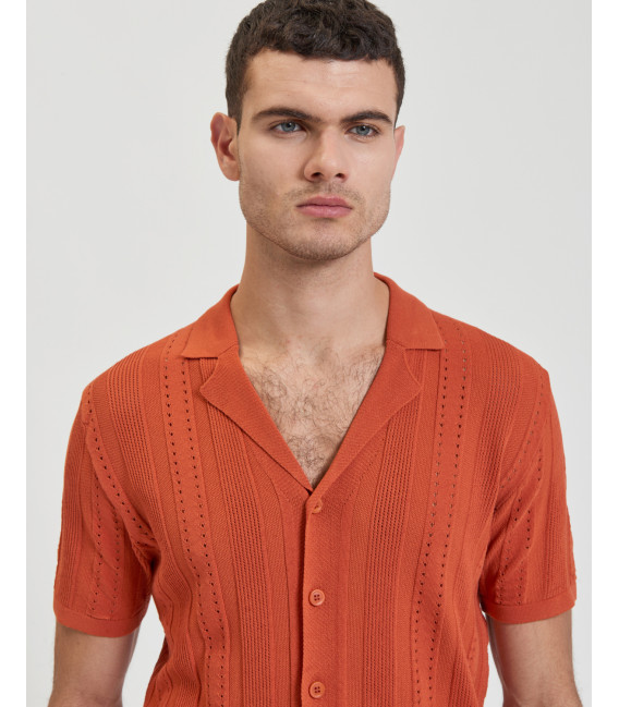 Knitted shirt with transparencies