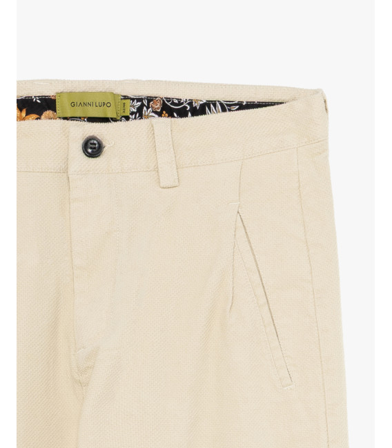 Cotton trousers with dotted effect