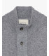 Knitted cardigan with funnel neck and button fastening.