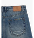 Denim bermuda shorts with used wash and destroyed details