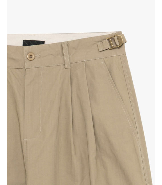 Pleated trousers with side buckles