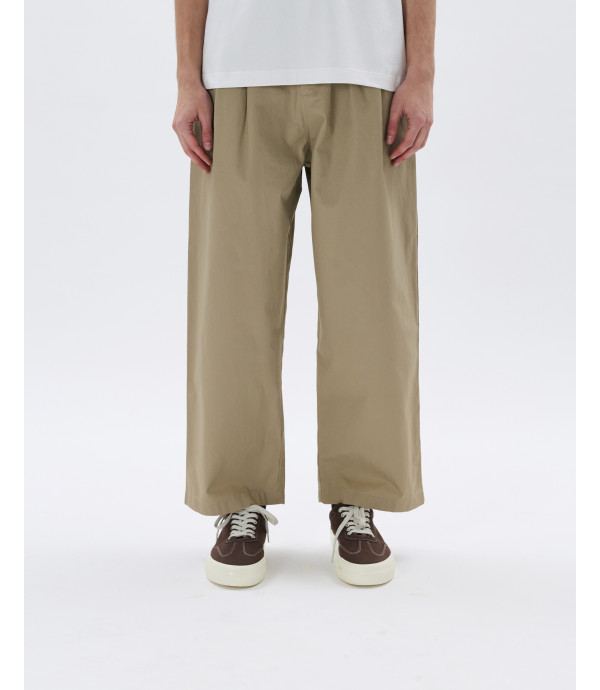 Pleated trousers with side buckles