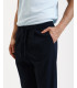 Pantaloni relaxed fit con pinces e chiusura con bottone sul fondo