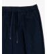 Pantaloni relaxed fit con pinces e chiusura con bottone sul fondo