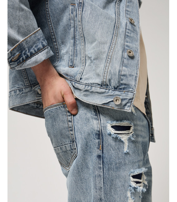 Denim jacket with rips